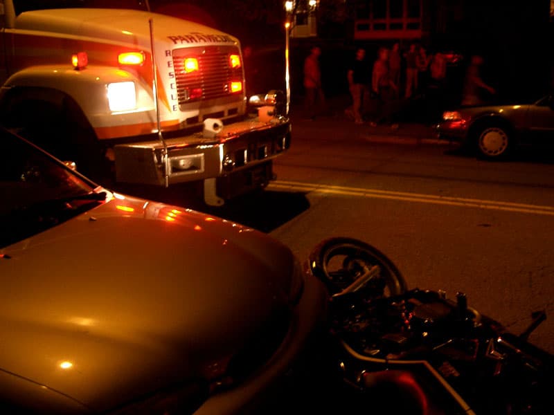 Motorcycle accident into Merle's car