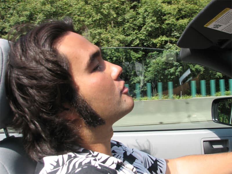 Robin driving his rental Stang