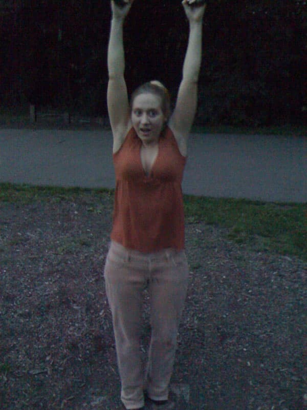 Lara hanging from rings in Frick Park